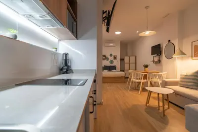 a kitchen and living room with a sink and a counter at VLC HOST - Ausias March in Valencia