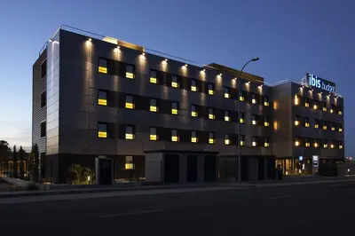 a large building with lights on top of it at Ibis Budget Valencia Alcasser in Silla
