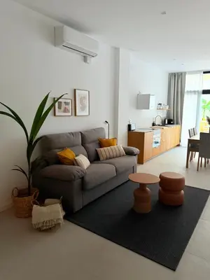 a living room with a couch and a table at Loft Taronja Ruzafa-Parque central in Valencia