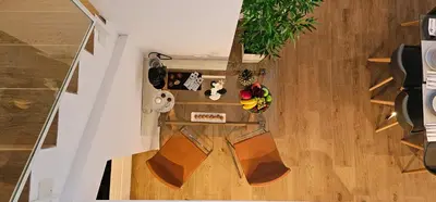 an overhead view of a living room with wood floors at Apartamento Ciudad de Las Ciencias - Apartamento Ciudad de Les Arts in Valencia