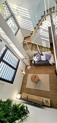 a room with a bed and a tv on the ceiling at Apartamento Ciudad de Las Ciencias - Apartamento Ciudad de Les Arts in Valencia