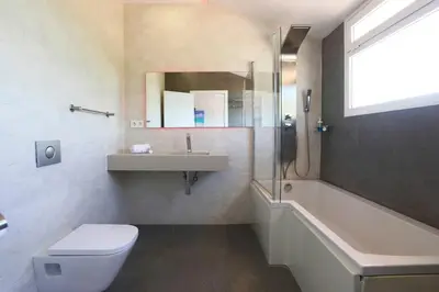 a bathroom with a toilet and a sink and a shower at Fantasy Villa Valencia - Airport & Circuit Ricardo Tormo in Chiva
