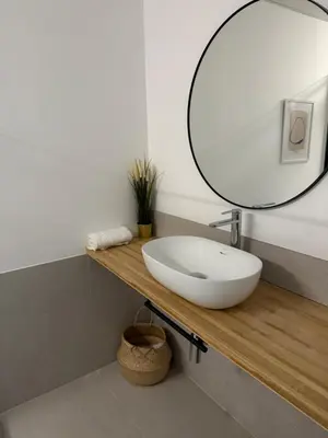 a bathroom with a white sink and a mirror at Loft Mar Ruzafa-Parque central in Valencia