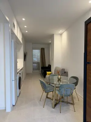 a living room with a table and chairs at MAGNO Loft- CIENCIAS in Valencia