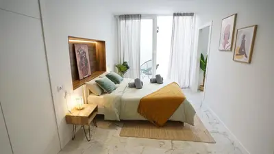 a bedroom with a bed in a room with a window at Modern Loft in Patraix, Valencia - Near City Center in Valencia