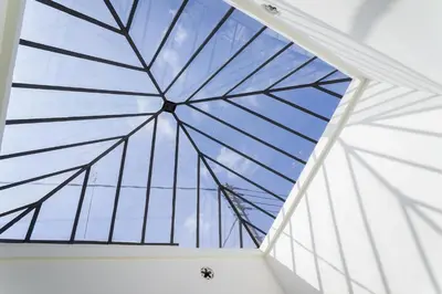 a glass ceiling in a room with a blue sky at Hotel San Lorenzo Boutique Plaza in Valencia