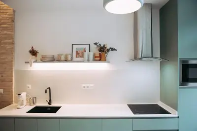 a kitchen with a sink and a counter top at Parc Central Mint Apartment in Valencia