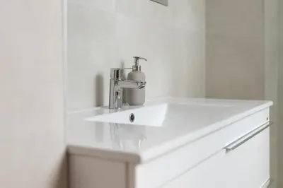 a white sink in a bathroom with a faucet at Habitación Cardenal 4 in Valencia