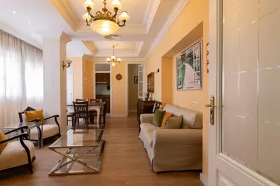 a living room with a couch and a table at Central Apartment Sleeps 6 Fast Wi-Fi 2 Bathrooms in Valencia