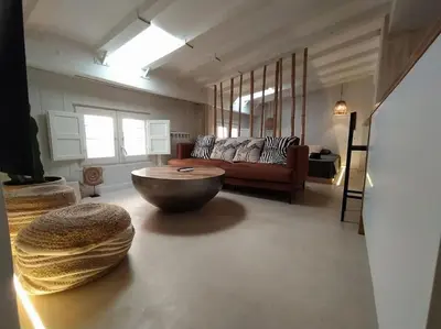 a living room with a couch and a coffee table at Estudio Cama King in Valencia