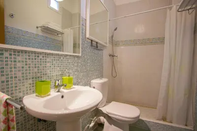 a bathroom with a sink and a toilet at Valencia central apartment in Valencia
