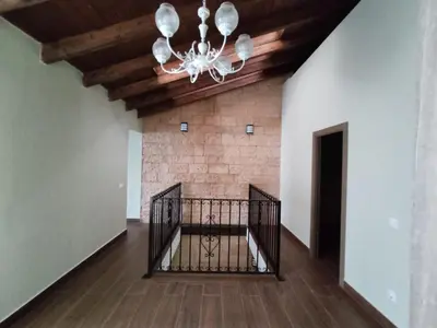 a staircase in a house with a chandelier at Casa Bonaire in Chella