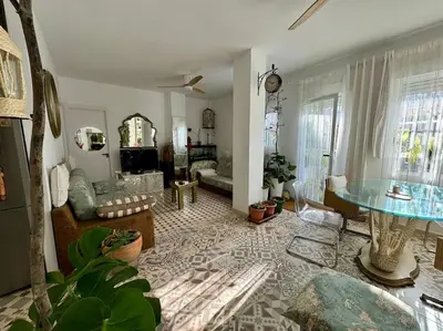 a living room with a couch and a table at Casa típica Valenciana in Valencia