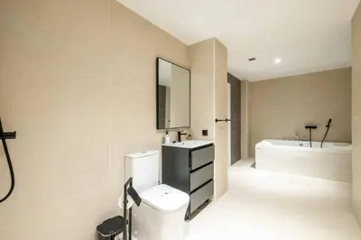 a bathroom with a toilet and a sink and a tub at Flats nou Mestalla in Valencia