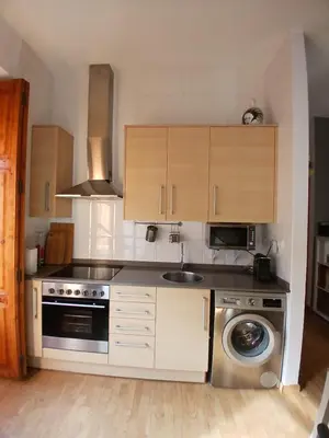 a kitchen with a sink and a dishwasher at Cozy flat in old town in Valencia
