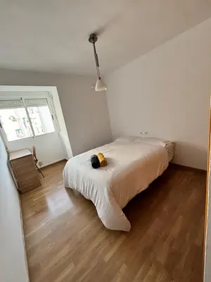 a bedroom with a large bed in a room at Cute and Cosy Room in Valencia
