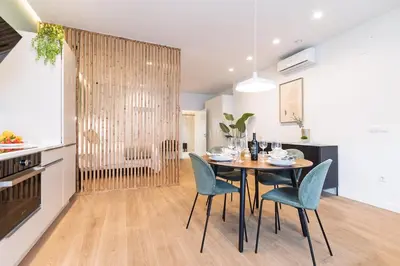 a kitchen and dining room with a table and chairs at SariStays Valencia Urban Chic Loft in Valencia