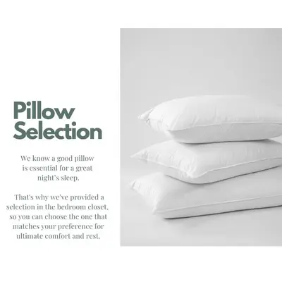 a stack of white pillows sitting on a bed at Stylish apartment near Old town & Turia park in Valencia