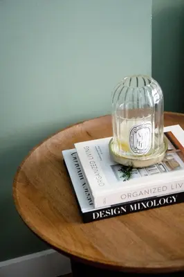 a table with a glass jar on top of a book at Stylish apartment near Old town & Turia park in Valencia