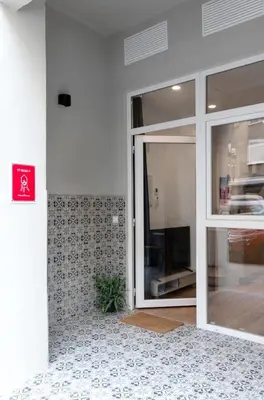 a glass door of a building with a window at Stylish apartment near Old town & Turia park in Valencia