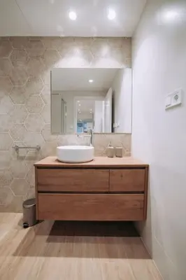 a bathroom with a sink and a mirror at Nuevo y moderno loft en amistat in Valencia