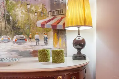 a lamp sitting on a table next to a painting at Loft Valencia centro - Vive el corazón de la ciudad in Valencia