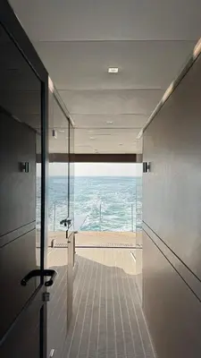 a bed with a bouquet of red roses on it at Luxury Catamaran Stay in Valencia Marina in Valencia