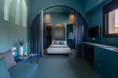 a bedroom with a bed in a blue room at Point Beach blue in Valencia