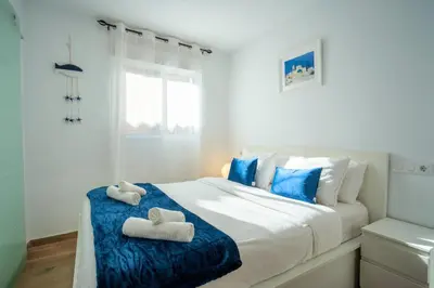 a bedroom with a bed with two towels on it at Apto 2 P Ferrandis in Valencia