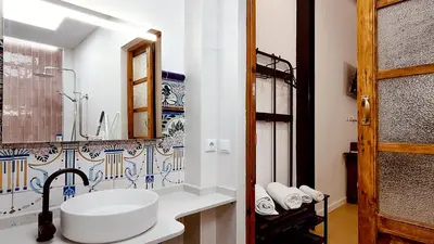 a bathroom with a sink and a mirror at casa del Cabanyal La Playa in Valencia