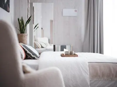 a white bedroom with a bed and a couch at New Light Cozy Stay Ruzafa in Valencia