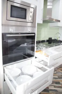 a kitchen with an oven with plates in it at District Key - Carricola in Valencia