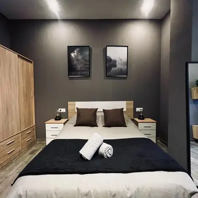 a bedroom with a bed with a plant in it at CITY FLATS - Avenida Baleares in Valencia