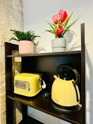 a yellow toaster and a toaster on a shelf at ORI B Nice & Spacious Flat Close to the Center in Valencia