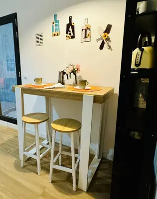 a kitchen island with two stools and a counter top at ORI B Nice & Spacious Flat Close to the Center in Valencia