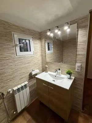 a bathroom with a sink and a mirror at Paraiso Natural Unico -Villa Cueva Turche in Valencia