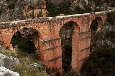 an old brick bridge on the side of a mountain at Casa Rebel in Chelva