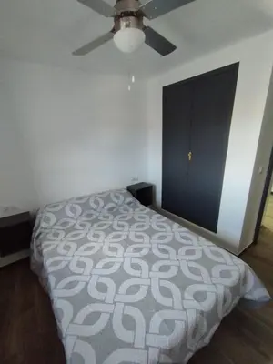 a bedroom with a bed and a ceiling fan at Casa Rebel in Chelva