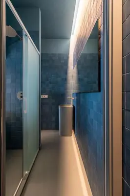 a bathroom with a shower and a trash can at Valencia Malvarrosa beach point blue in Valencia