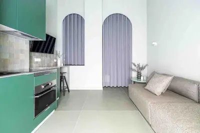 a living room with a couch and a kitchen at Valencia Malvarrosa Beach point green in Valencia