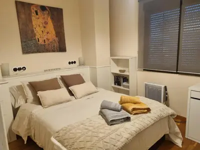 a bedroom with a bed with towels on it at Les Dos Nines in Monserrat