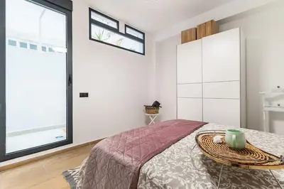 a book shelf with a home basket and books at Che Loft! Artes y Ciencias in Valencia