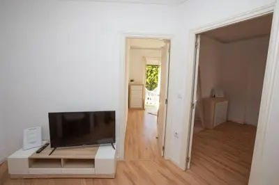 a living room with a flat screen tv on a entertainment center at Lujoso Apartamento en Valencia 3 Dormitorios con Parking in Paterna