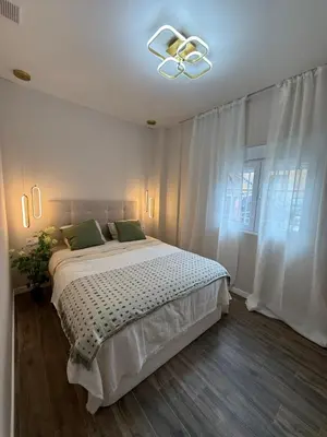 a bedroom with a bed and a ceiling fan at Urban Soul Studio in Valencia