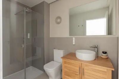 a bathroom with a toilet and a sink and a shower at Líbere Valencia Ruzafa in Valencia