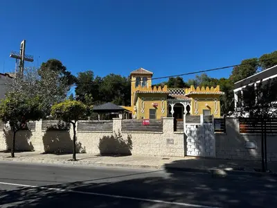 a yellow building on the side of a street at Vacansis Chalet 3 Vedat in Torrent