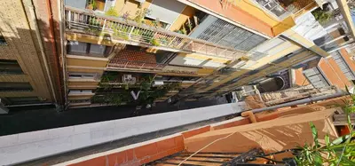 an overhead view of a building with balconies and plants at Vacansis Atico Loft El Mercat in Valencia