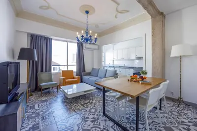a living room with a table and a dining room at Apartment Ruzafa 4 bedroom in Valencia