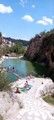 a group of people swimming in a river at Casa Maibeca in Bolbaite
