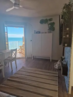 a living room with a view of the ocean at arena y mar in Tavernes de Valldigna